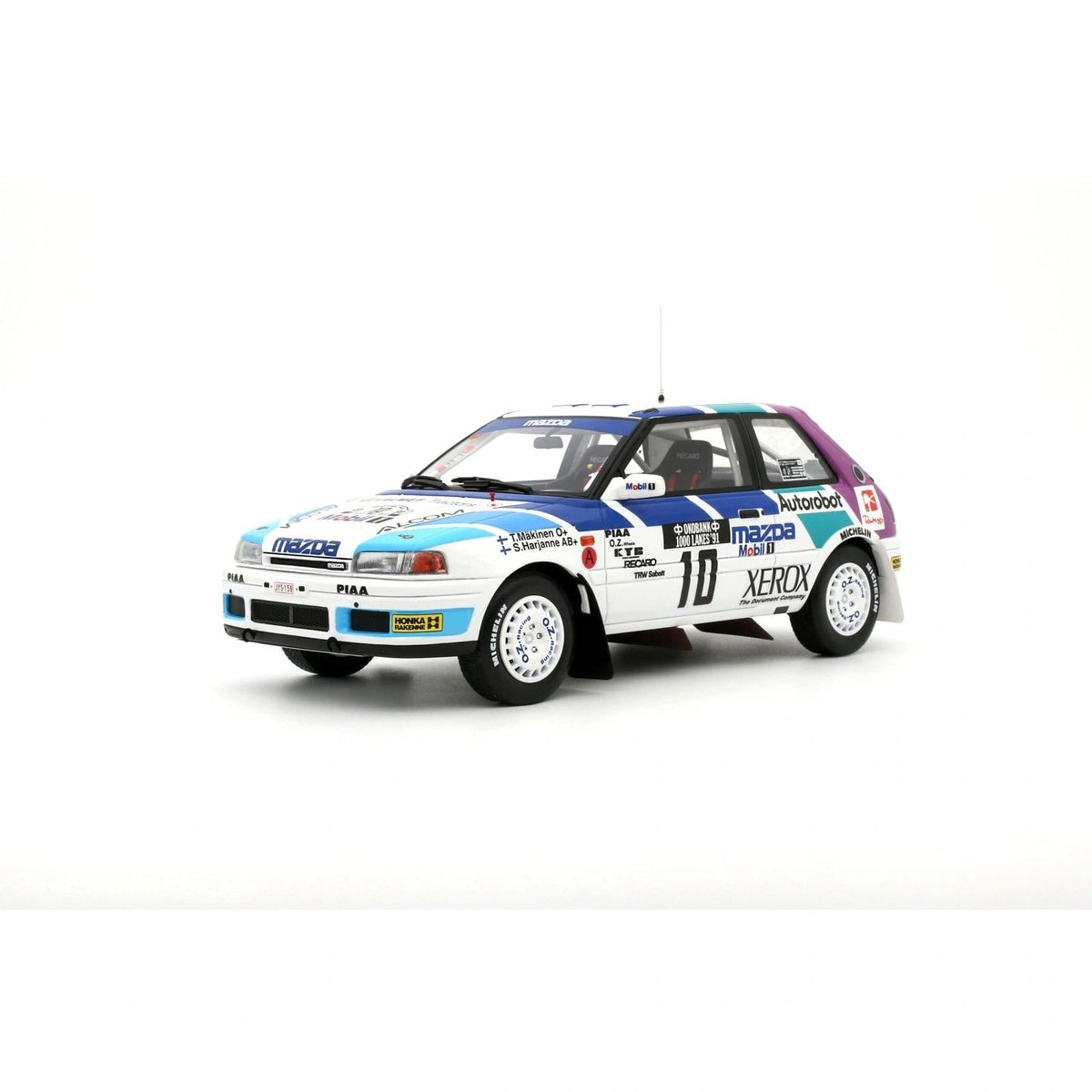 OTTOMOBILE 1:18 - Mazda 323 GTX #10 5° Rallye 1000 Lakes 1991 Mäkinen-Harjanne